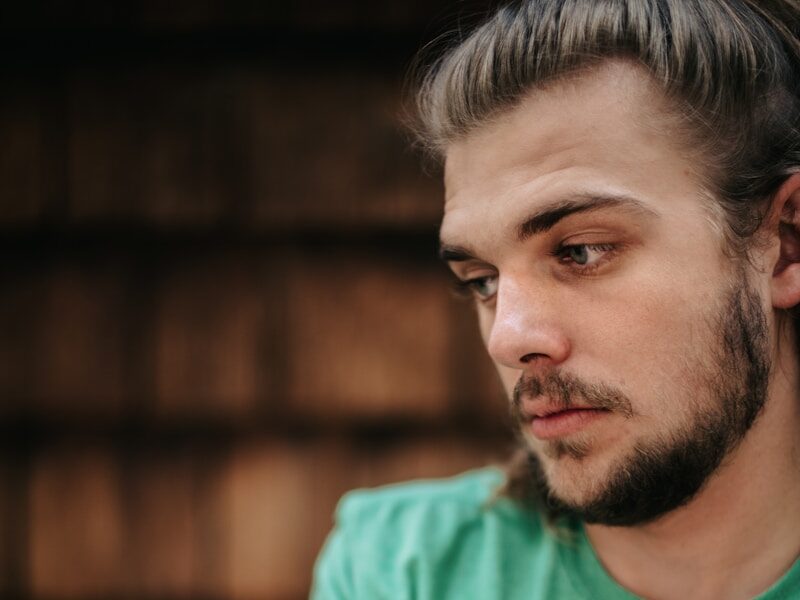 man in green crew neck t-shirt