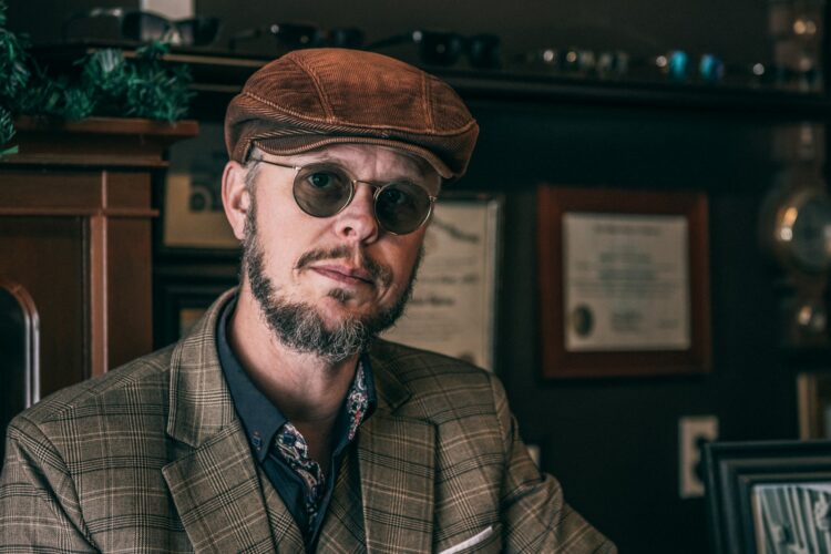 man in brown hat and black sunglasses