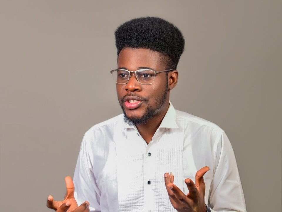 A man wearing glasses and a white shirt