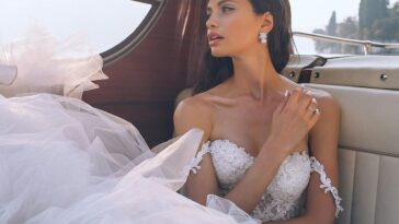 woman wearing white sweetheart-neckline wedding dress inside vehicle