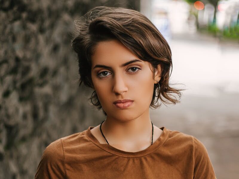 Portrait of a fashionable young woman standing outdoors in São Paulo, Brazil.