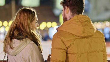 merry christmas, couple, young people, people, blonde, friendship, together, talking, fence, winter, holiday, lights, ornaments, decoration, back view, snapshot