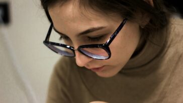 woman in black framed eyeglasses