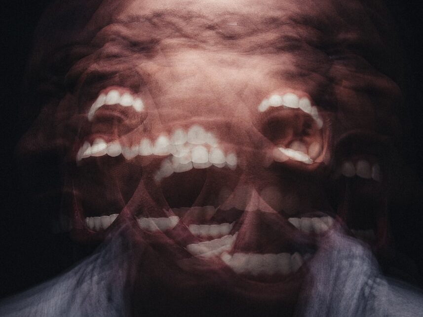 mans face with white scarf