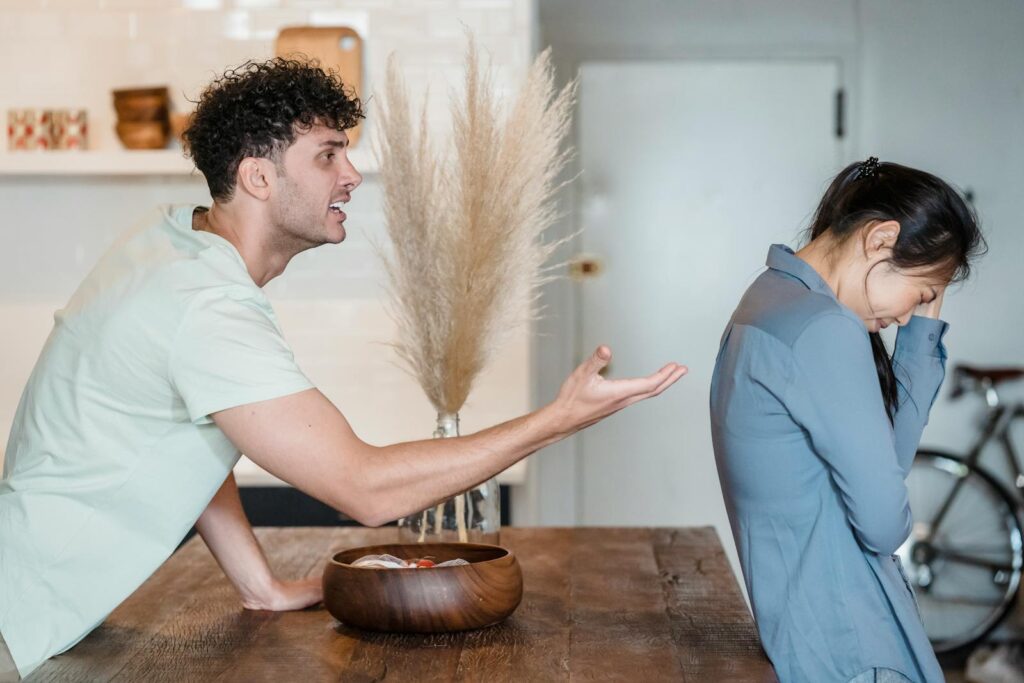 An intense argument between a couple indoors, depicting emotional distress and communication issues.