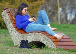 woman, young, nature, sitting, bench, park, looking, smartphone, relaxation, sunglasses, jeans, lifestyle, spring