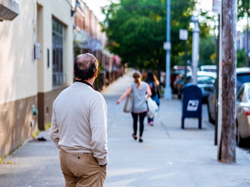 man standing outside looking forward