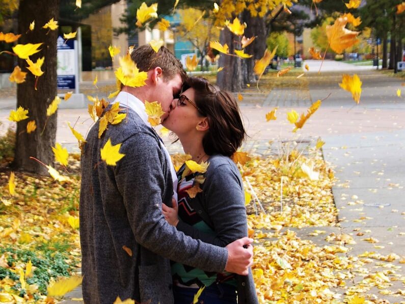 couple kissing during autumn