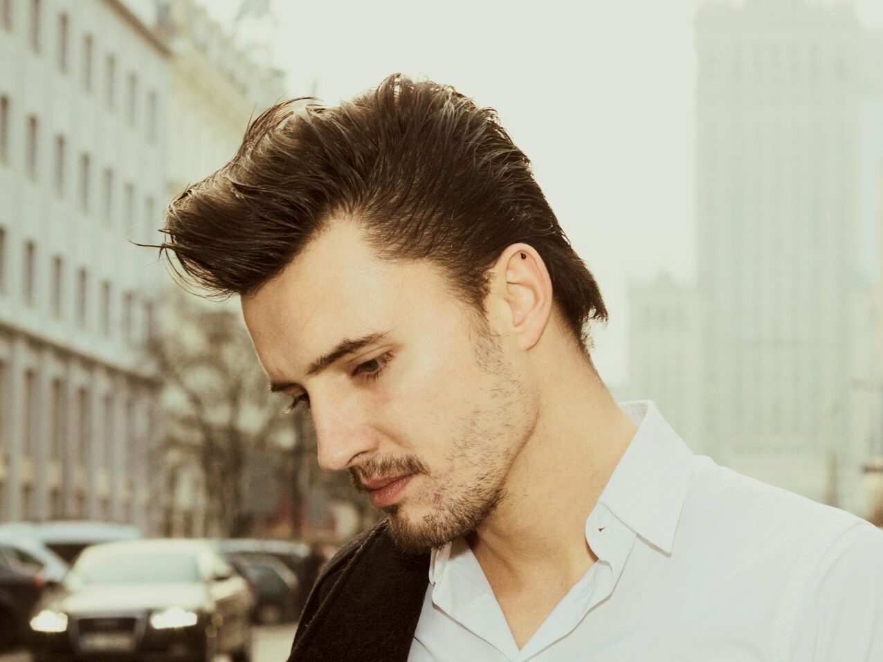 a man in a white shirt and a black jacket
