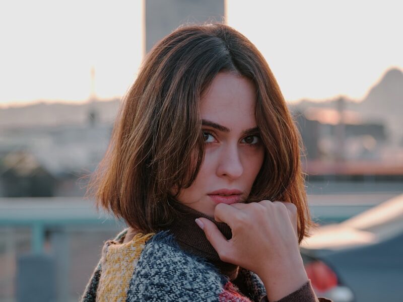 woman in brown and white scarf