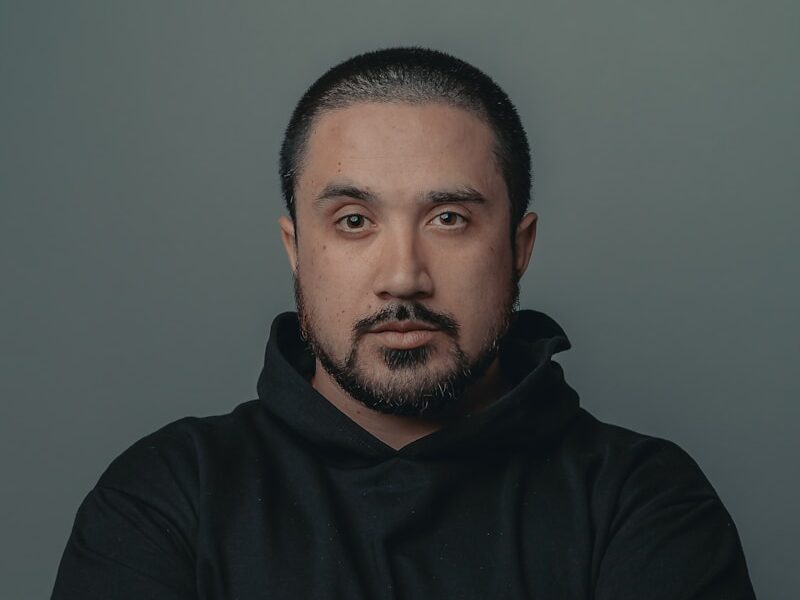 man in black hoodie standing