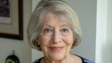 an older woman with a smile on her face