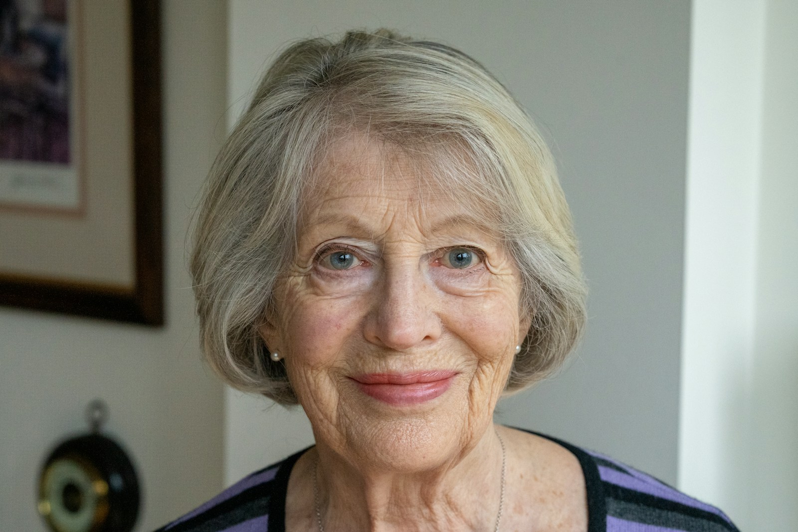 an older woman with a smile on her face