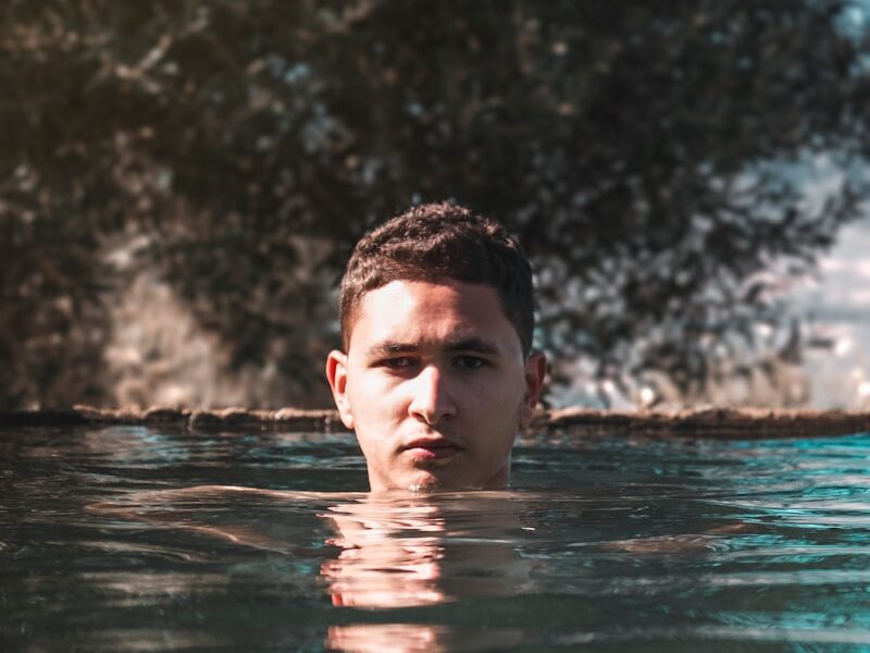 a man swimming in a body of water