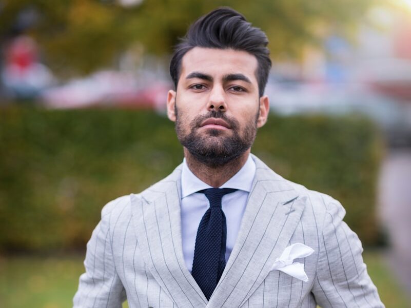 man in white and black pinstripe suit jacket