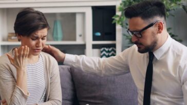 a man and a woman sitting on a couch