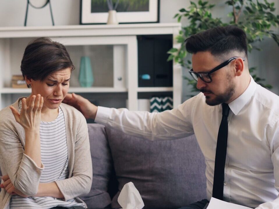 a man and a woman sitting on a couch