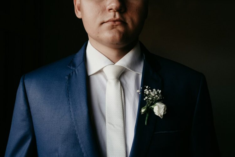 man in blue suit jacket