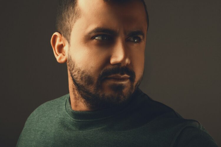 a close up of a man with a beard