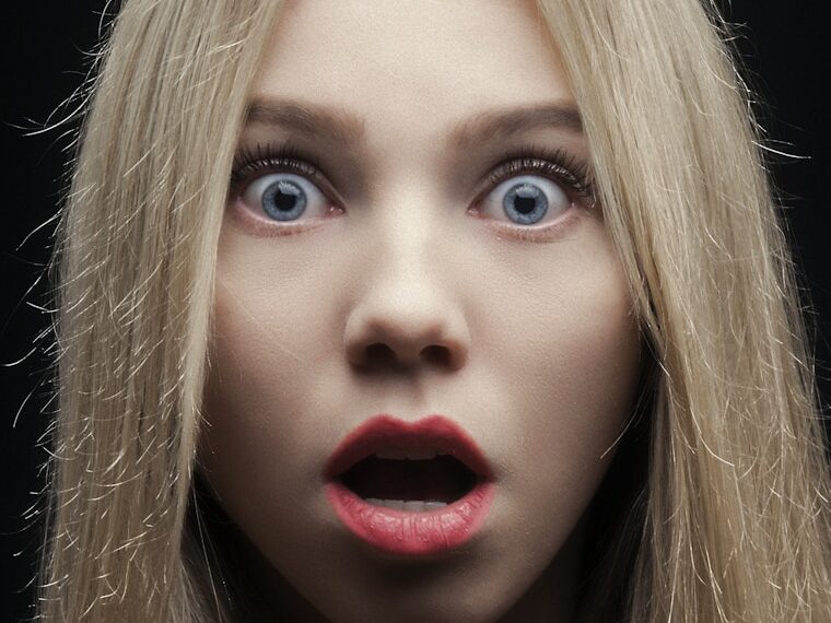 woman with blonde hair and red lipstick