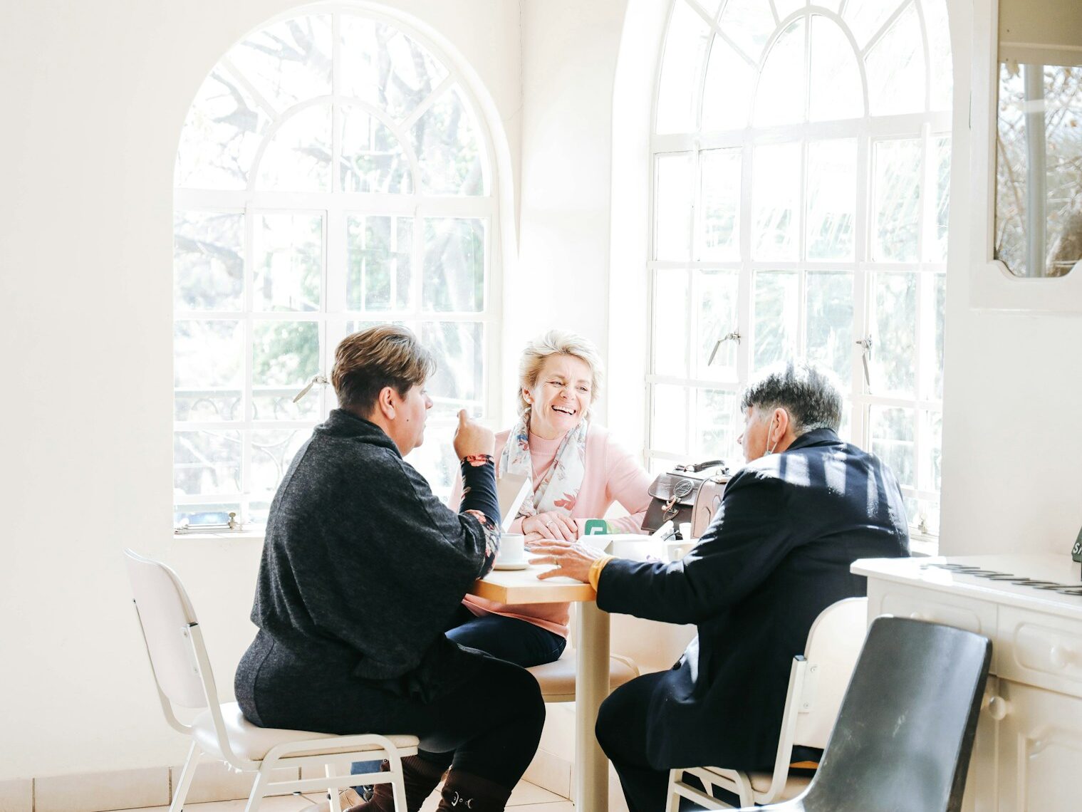a group of people sitting around a table
