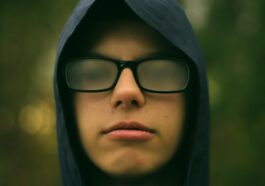 selective focus photography of man wearing eyeglasses