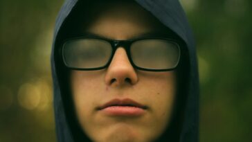 selective focus photography of man wearing eyeglasses