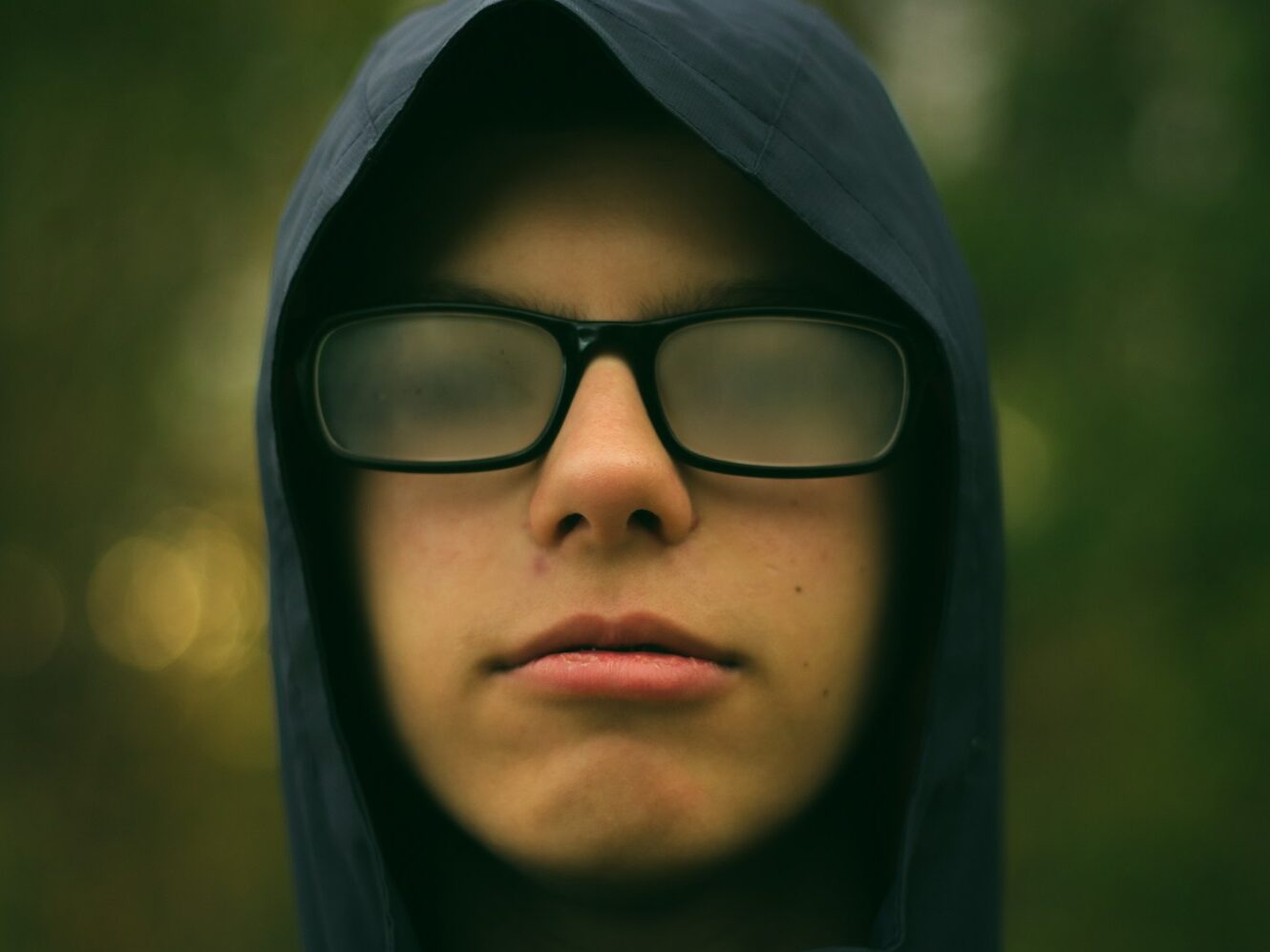selective focus photography of man wearing eyeglasses