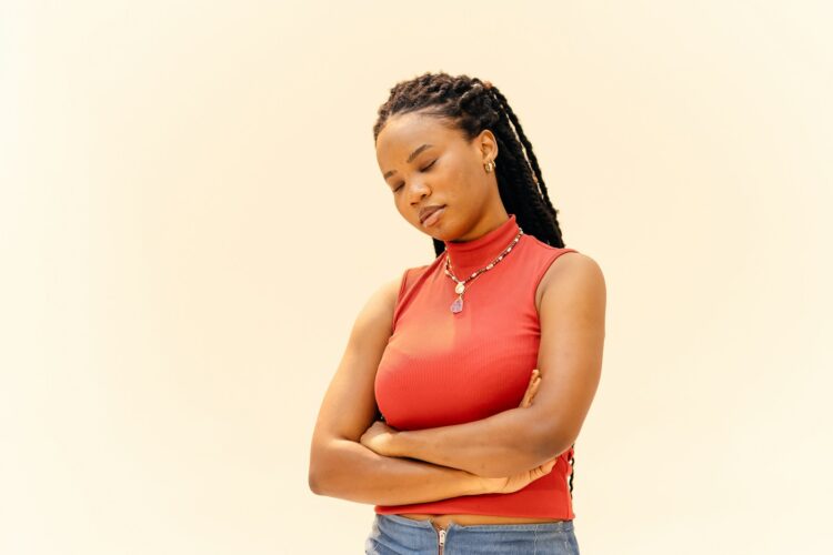 A woman standing with her arms crossed