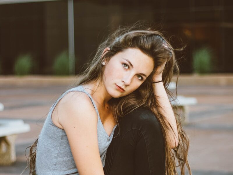 woman sitting on picnic table