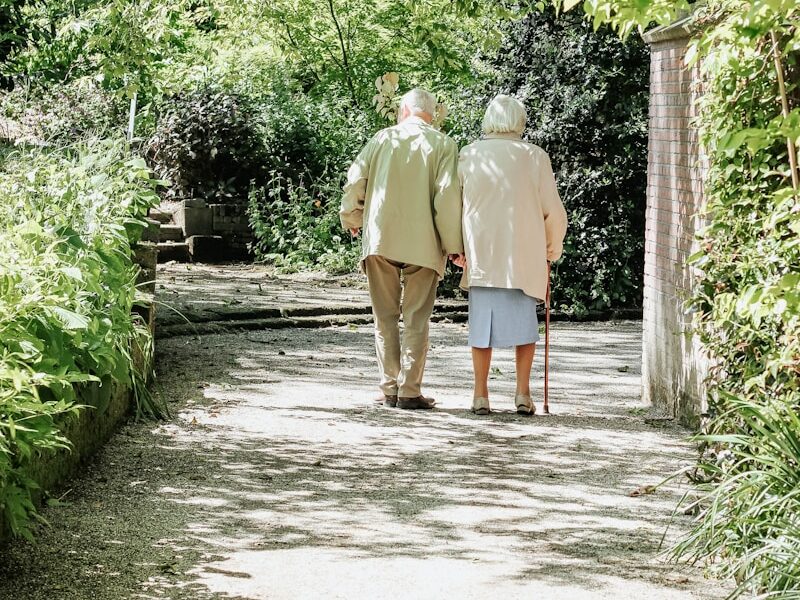 man and woman walking on road during daytime