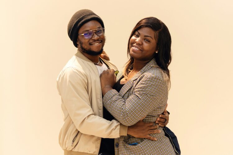 A couple of people that are hugging each other