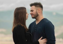 man in black long sleeve shirt kissing woman in black long sleeve shirt