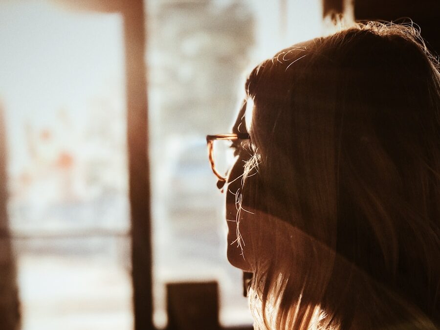 shallow focus photography of woman facing door