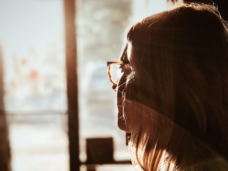 shallow focus photography of woman facing door