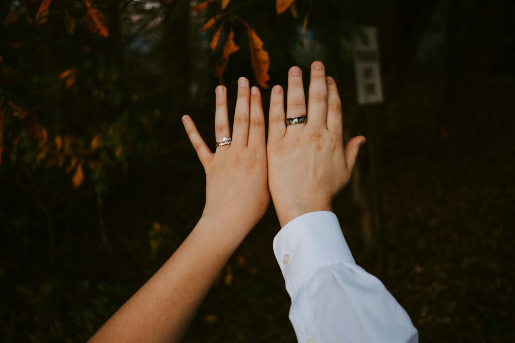 person in white long sleeve shirt with silver ring