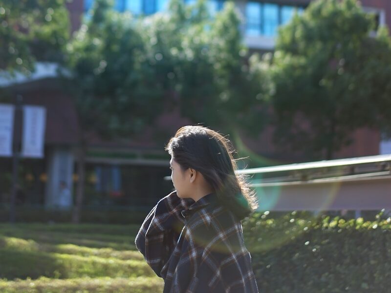 woman beside grass