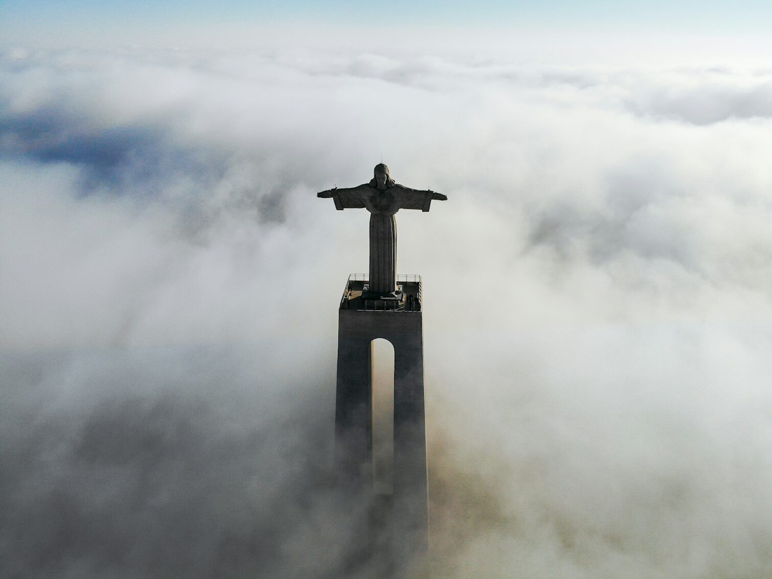 Christ Redeemer covered with clouds at daytime