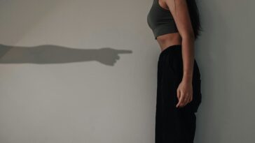 woman in black tank top and black pants