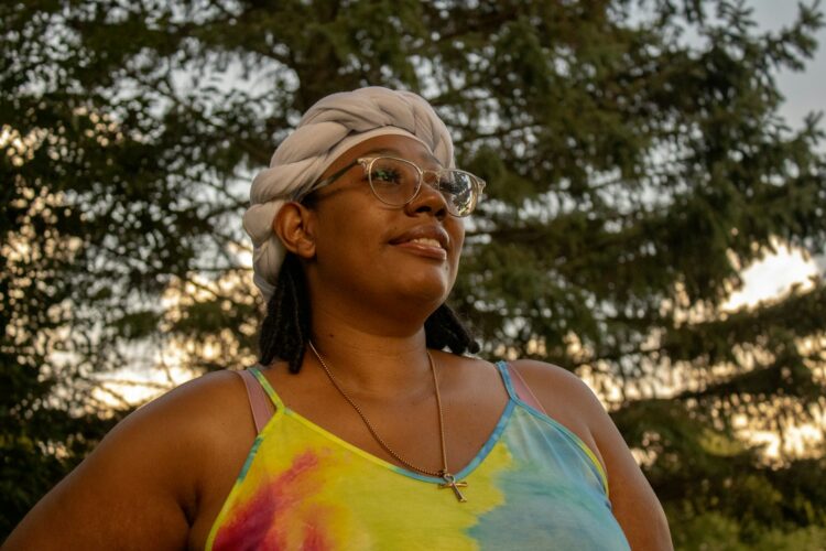 a woman wearing a hat and glasses
