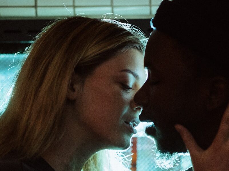 woman about to kiss man