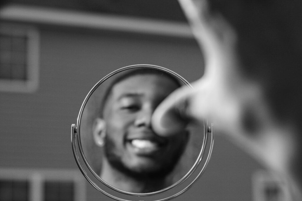 grayscale photo of mans face