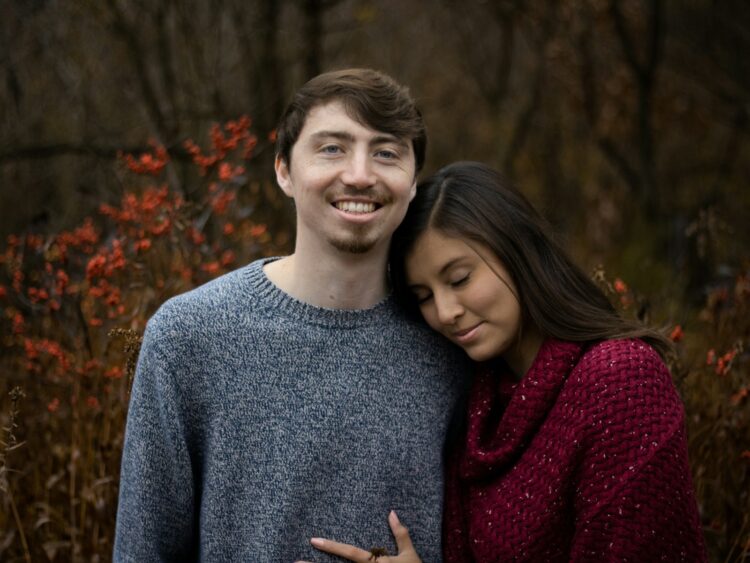 a man and a woman standing next to each other