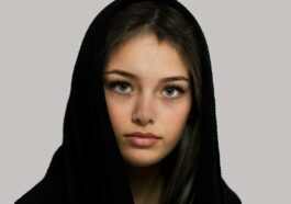 woman in black hijab taking selfie