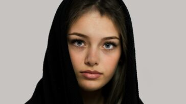 woman in black hijab taking selfie