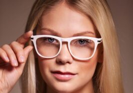 woman in black shirt wearing white framed eyeglasses
