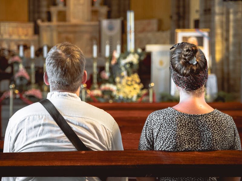 A foreign couple is praying inside the Nha Trang Stone Church.