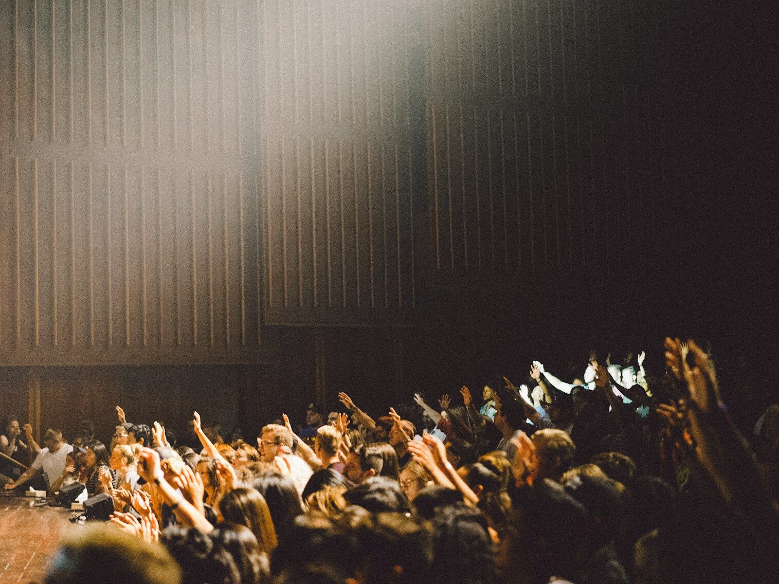 people raising their hands