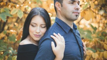 a man and a woman standing next to each other