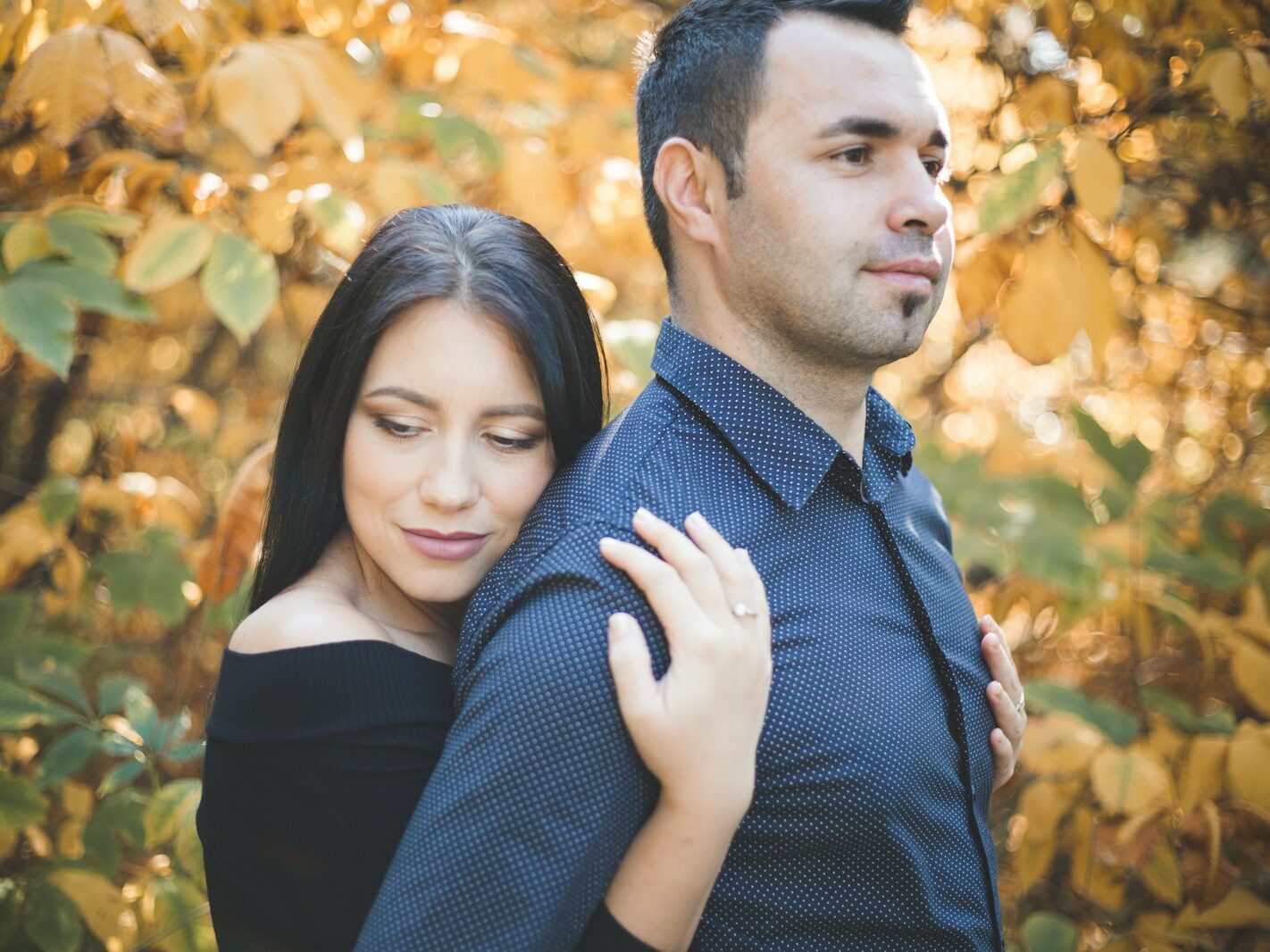 a man and a woman standing next to each other